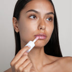 Model applying G.M. Collin Lip Plumping Oil, view 5