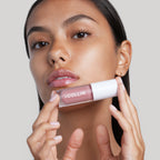 Model holding G.M. Collin Lip Plumping Oil, view 3